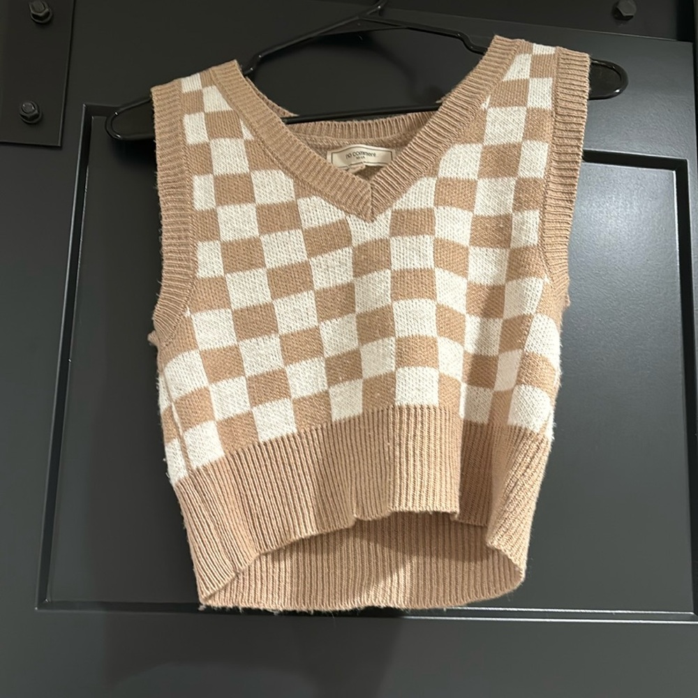 Checkered pattern with brown and cream colors. Tank top sweater